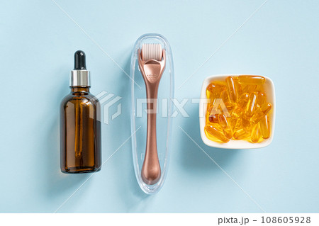 Complex treatment concept - vitamins, serum, derma roller Complex treatment concept - vitamins, serum, derma roller 108605928