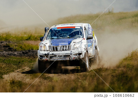 racing car high speed moving on dusty road during cross country rally racing car high speed moving on dusty road during cross country rally 108610662