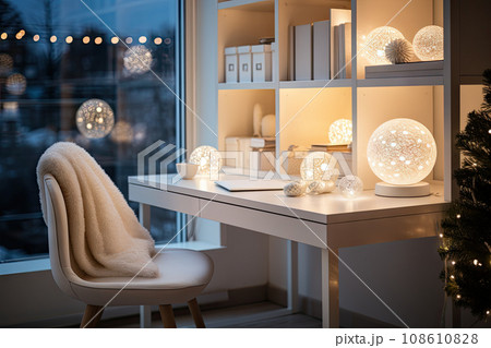 a desk with christmas lights on it and a chair in front of the window looking out to the city outside 108610828