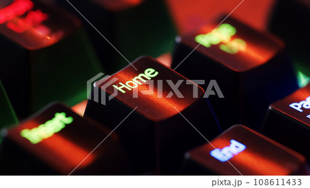 Keyboard key  - Home - macro shot.  Modern gaming keyboard close-up with beautiful color backlight.   108611433