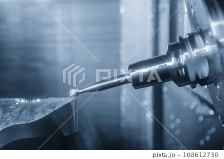 The 5-axis CNC milling machine  cutting the metal part with solid ball end mill tool. 108612730