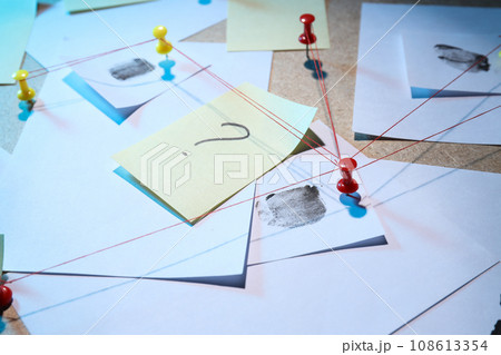 The papers are connected with threads on the board The papers are connected with threads on the board 108613354