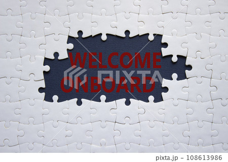 Welcome onboard symbol. Concept words Welcome onboard on white puzzle. Beautiful dark blue background. Business and Welcome onboard concept. Copy space. Welcome onboard symbol. Concept words Welcome onboard on white puzzle. Beautiful dark blue background. Business and Welcome onboard concept. Copy space. 108613986