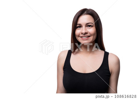 Happy young stylish woman with black hair wearing a black t-shirt Happy young stylish woman with black hair wearing a black t-shirt 108616828