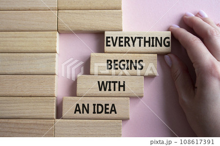 Everything begins with and Idea symbol. Concept words Everything begins with and Idea on wooden blocks. Beautiful pink background. Businessman hand. Business. Copy space. Everything begins with and Idea symbol. Concept words Everything begins with and Idea on wooden blocks. Beautiful pink background. Businessman hand. Business. Copy space. 108617391