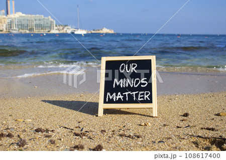 Our Minds Matter symbol. Concept words Our Minds Matter on black chalk blackboard. Beautiful sea background. Psychological social and Our Minds Matter concept. Copy space. 108617400