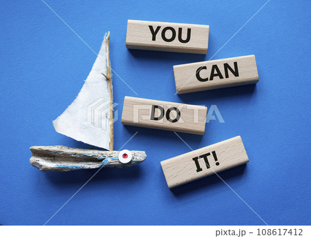 You can do it symbol. Concept words You can do it on wooden blocks. Beautiful blue background with boat. Business and You can do it concept. Copy space. 108617412
