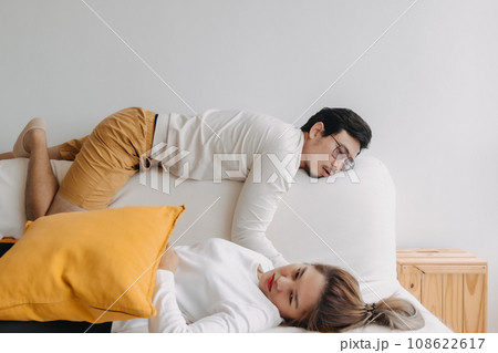 Bored and depressed mood asian lover couple lie on sofa in free empty day Bored and depressed mood asian lover couple lie on sofa in free empty day 108622617