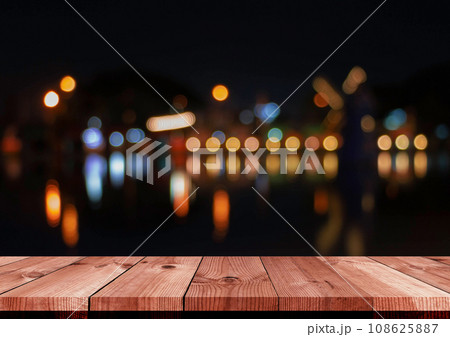 perspective wooden board over blurred bokeh at night 108625887