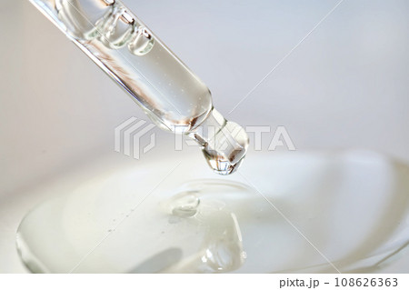 Pipette with perfume in a ray of sun. 108626363