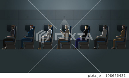 A senior white hair man is reading a book in a plane cabin alone in the dark A senior white hair man is reading a book in a plane cabin alone in the dark 108626421