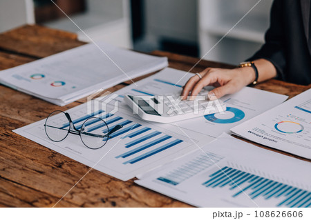 Business Documents, Auditor businesswoman checking searching document legal prepare paperwork or report for analysis TAX time,accountant Documents data contract partner deal in workplace office Business Documents, Auditor businesswoman checking searching document legal prepare paperwork or report for analysis TAX time,accountant Documents data contract partner deal in workplace office 108626606