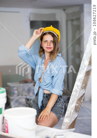 Sexy woman posing in building site Sexy woman posing in building site 108627219