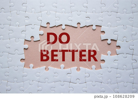 Do better symbol. White puzzle with words Do better. Beautiful pink background. Business and Do better concept. Copy space. 108628209