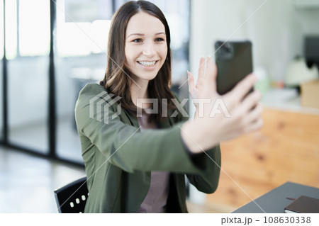 business owner or Asian female marketers are using business phones in office work 108630338