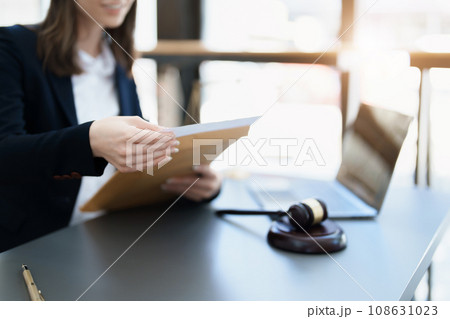 Portrait of a Asian woman lawyer studying a lawsuit for a client before going to court. Portrait of a Asian woman lawyer studying a lawsuit for a client before going to court. 108631023