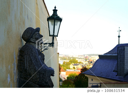 Guitarist in a hat monument Prague. September 2023 Statue of a man playing guitar at the Prague city Guitarist in a hat monument Prague. September 2023 Statue of a man playing guitar at the Prague city 108631534
