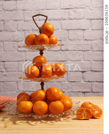 Antique Crystal Dish With Small Oranges. Dessert Display 108636156