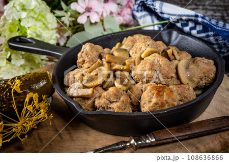 Meatballs served with pickled cucumber. Meatballs served with pickled cucumber. 108636866