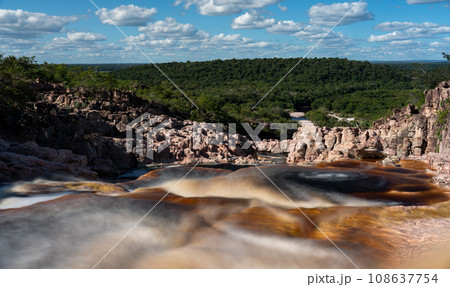 Blood Red Silky Water in the Roncador River with Cascades and Jungle Surrounding Blood Red Silky Water in the Roncador River with Cascades and Jungle Surrounding 108637754