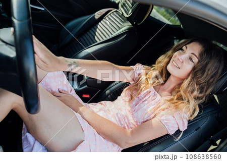 woman behind the wheel of a car car lady motorist trip travel 108638560