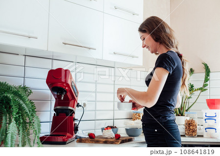 Female housewife cooking food in kitchen 108641819