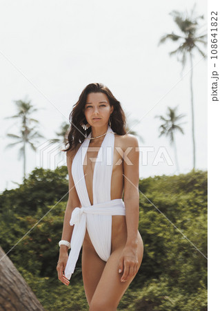 Luxury Vacation of Beach Fashion Woman in Stylish White Modern Swimwear 108641822