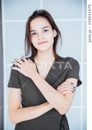 Portrait of a woman in a dress in a bright room 108641879