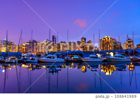 Beautiful view of Vancouver skyline with harbor at sunset, British Columbia, Canada Beautiful view of Vancouver skyline with harbor at sunset, British Columbia, Canada 108641989