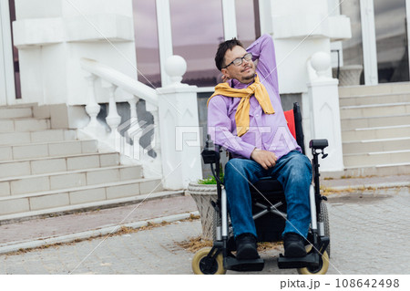 a special person with disabilities at the stairs of an office building a special person with disabilities at the stairs of an office building 108642498
