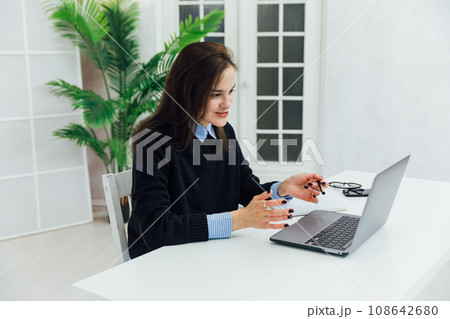 chat online via internet woman with laptop remote work chat online via internet woman with laptop remote work 108642680