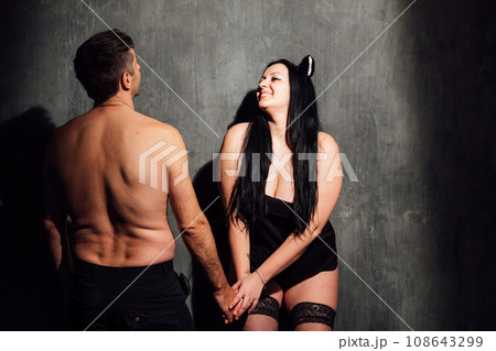 man and woman husband and wife couple lovers stand in a dark room man and woman husband and wife couple lovers stand in a dark room 108643299