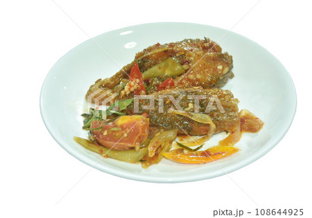 deep fried slice mango fish with tomato and chili in sweet sour sauce on plate deep fried slice mango fish with tomato and chili in sweet sour sauce on plate 108644925