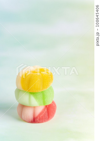 Gummies placed on a colorful background board. 108645406