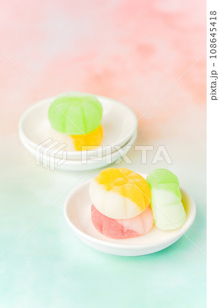 Gummies placed on a colorful background board. 108645418