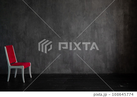 one red chair on a dark background in the room interior in the apartment one red chair on a dark background in the room interior in the apartment 108645774