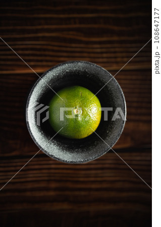Oranges placed on a wooden board 108647177