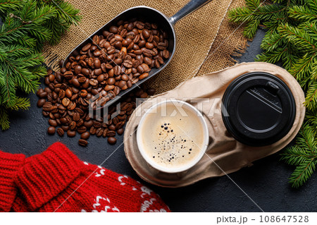 Coffee cup and fir tree branches in cozy setting 108647528