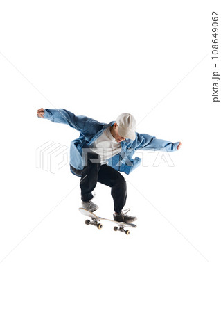 Dynamic image of young man in casual clothes in motion, training, skateboarding isolated over white background Dynamic image of young man in casual clothes in motion, training, skateboarding isolated over white background 108649062