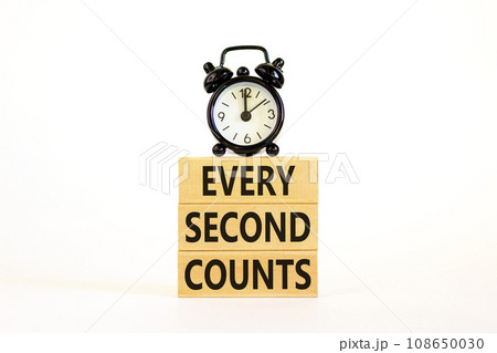 Every second counts symbol. Concept words Every second counts on wooden blocks on a beautiful white table white background. Black alarm clock. Business, motivational and every second counts concept. Every second counts symbol. Concept words Every second counts on wooden blocks on a beautiful white table white background. Black alarm clock. Business, motivational and every second counts concept. 108650030