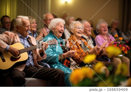 Elderly people at an evening concert in a nursing home, sitting and listening to music, a mood of joy 108650409