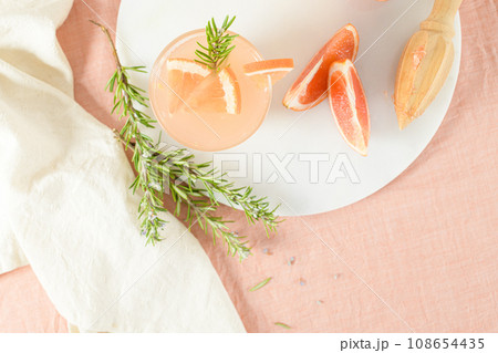 Grapefruit juice with rosemary Grapefruit juice with rosemary 108654435