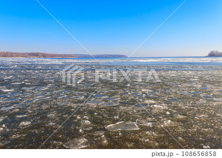 View of a lake with melting ice at spring View of a lake with melting ice at spring 108656858