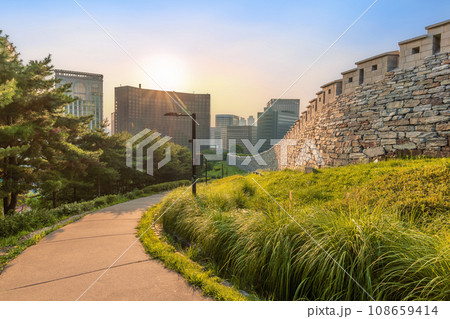 Namsan Park walkway with the stone wall at the sunset Namsan Park walkway with the stone wall at the sunset 108659414