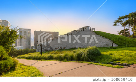 Sunset over the Namsan Park walkway with modern skyscrapers in Seoul, South Korea Sunset over the Namsan Park walkway with modern skyscrapers in Seoul, South Korea 108659416