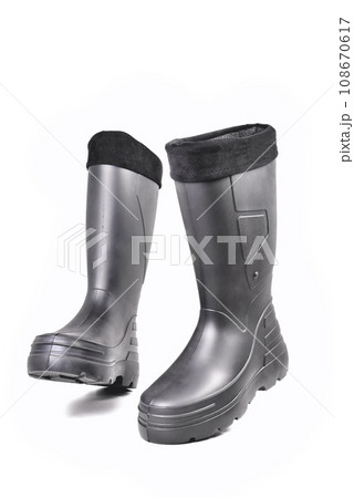black high insulated boots for hunting off-road fishing and traveling in the cold season on a white background isolate black high insulated boots for hunting off-road fishing and traveling in the cold season on a white background isolate 108670617
