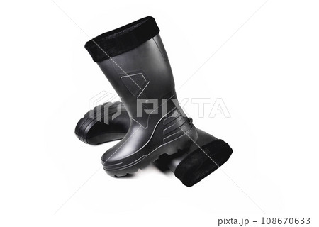 black high insulated specialized boots for hunting off-road fishing and traveling in the cold season on a white background isolate 108670633