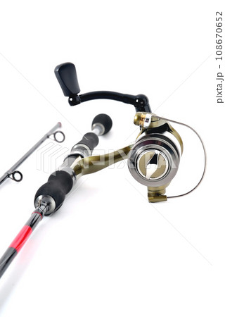 fishing reel on a fishing rod, white background close-up fishing reel on a fishing rod, white background close-up 108670652