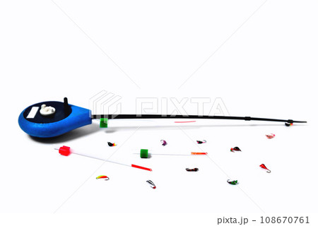 Fitted fishing rod for winter fishing and fishing spoon-bait on white background, close-up 108670761