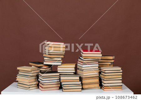 learning literacy science education stack of books on a brown background learning literacy science education stack of books on a brown background 108673462
